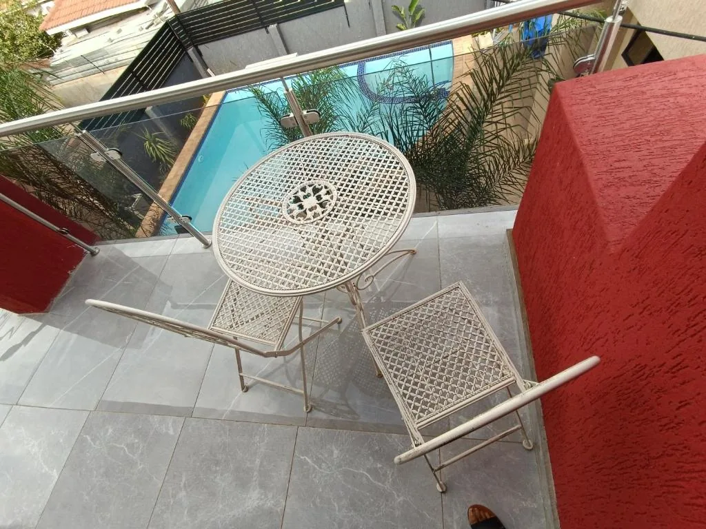 Standard Room 5 balcony overlooking the pool